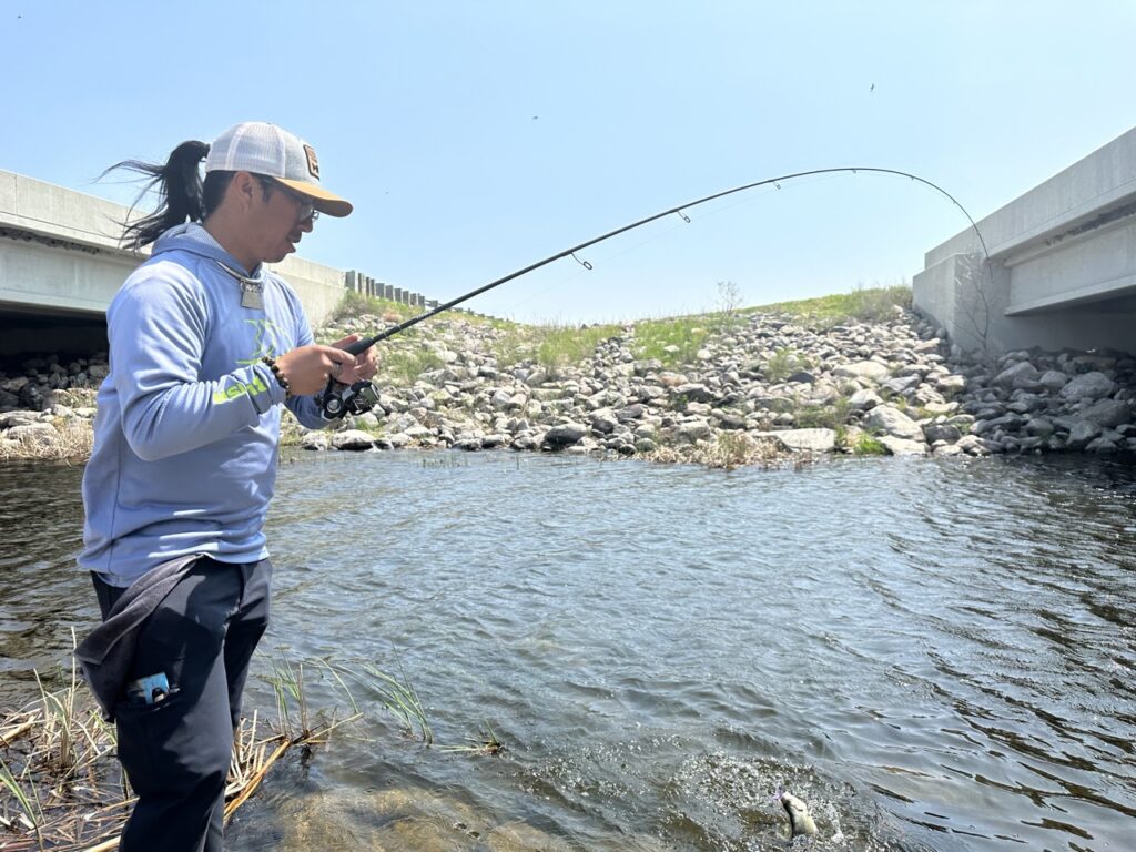 Foto Stock Fishing activities. rod with baitcasting reel with